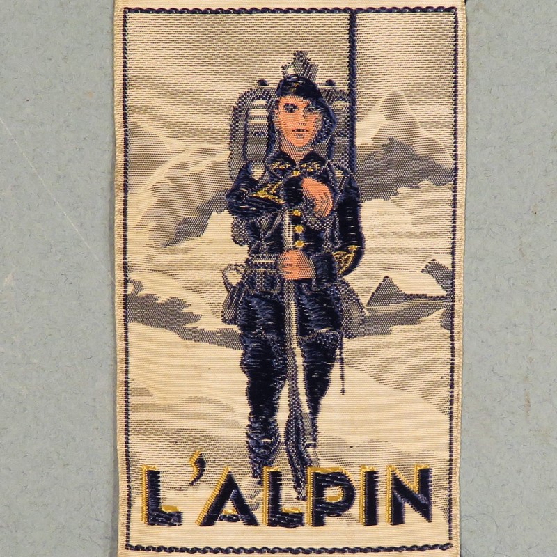 INSIGNE TISSU FANTAISIE "L'ALPIN" CHASSEUR ALPIN DES ANNEES 1930 A IDENTIFIER ??